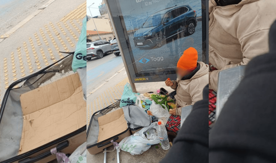 İzmir’in Konak ilçesi, Alsancak Garı yakınlarında, otobüs durağında bir evsiz