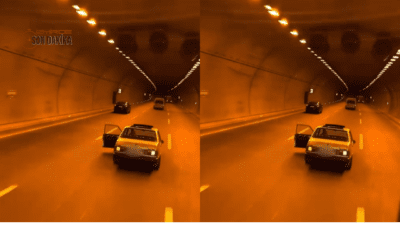 İzmir Kemalpaşa Tünelleri içerisinde bir araç, açık kapı ile trafikte